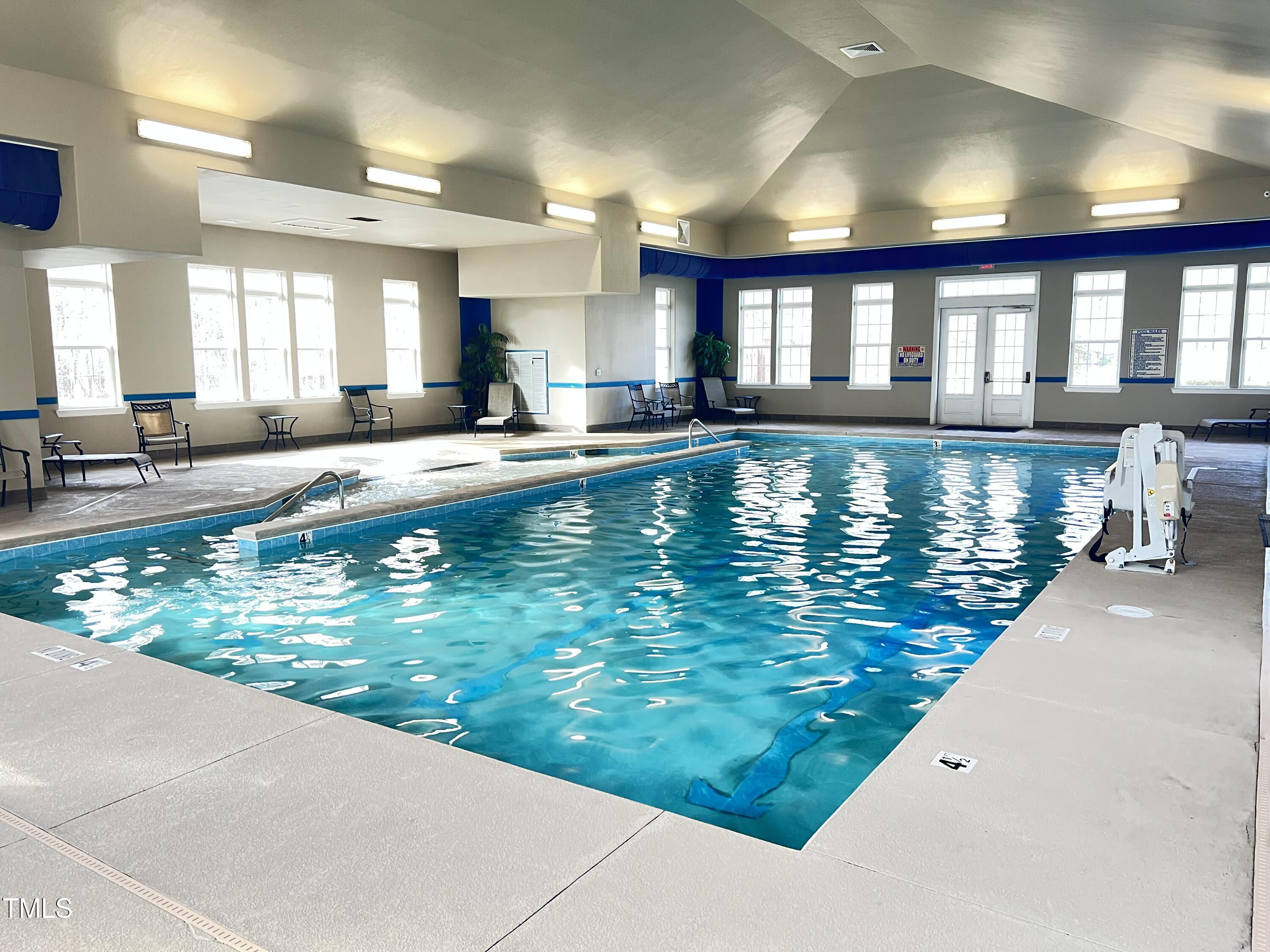 1040 Lippincott Road Durham, NC 27703 - Photo 37 of 43 a large swimming pool that has lawn chairs in it