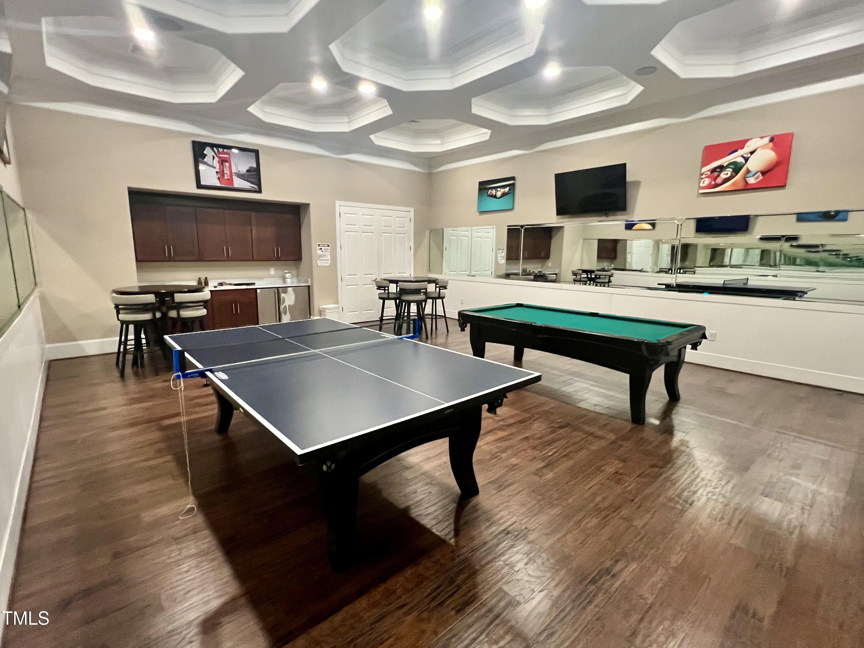 1040 Lippincott Road Durham, NC 27703 - Photo 42 of 43 a living room with furniture and a flat screen tv