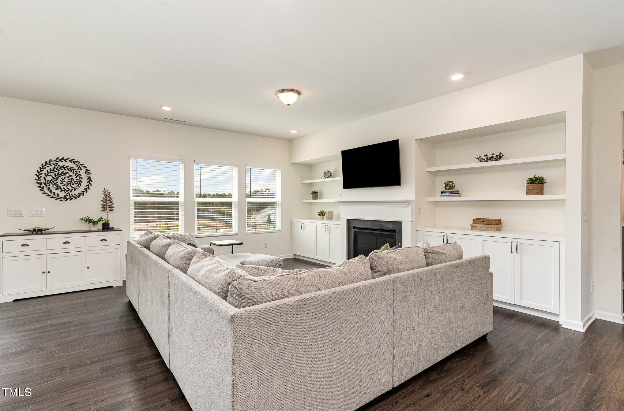 1040 Lippincott Road Durham, NC 27703 - Photo 6 of 43 a living room with furniture fireplace and flat screen tv