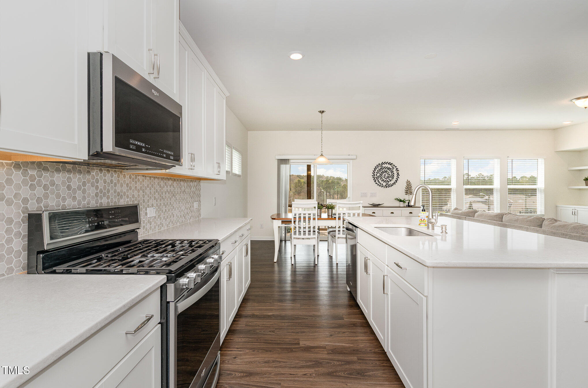 1040 Lippincott Road Durham, NC 27703 - Photo 8 of 43 a kitchen with a stove and a microwave