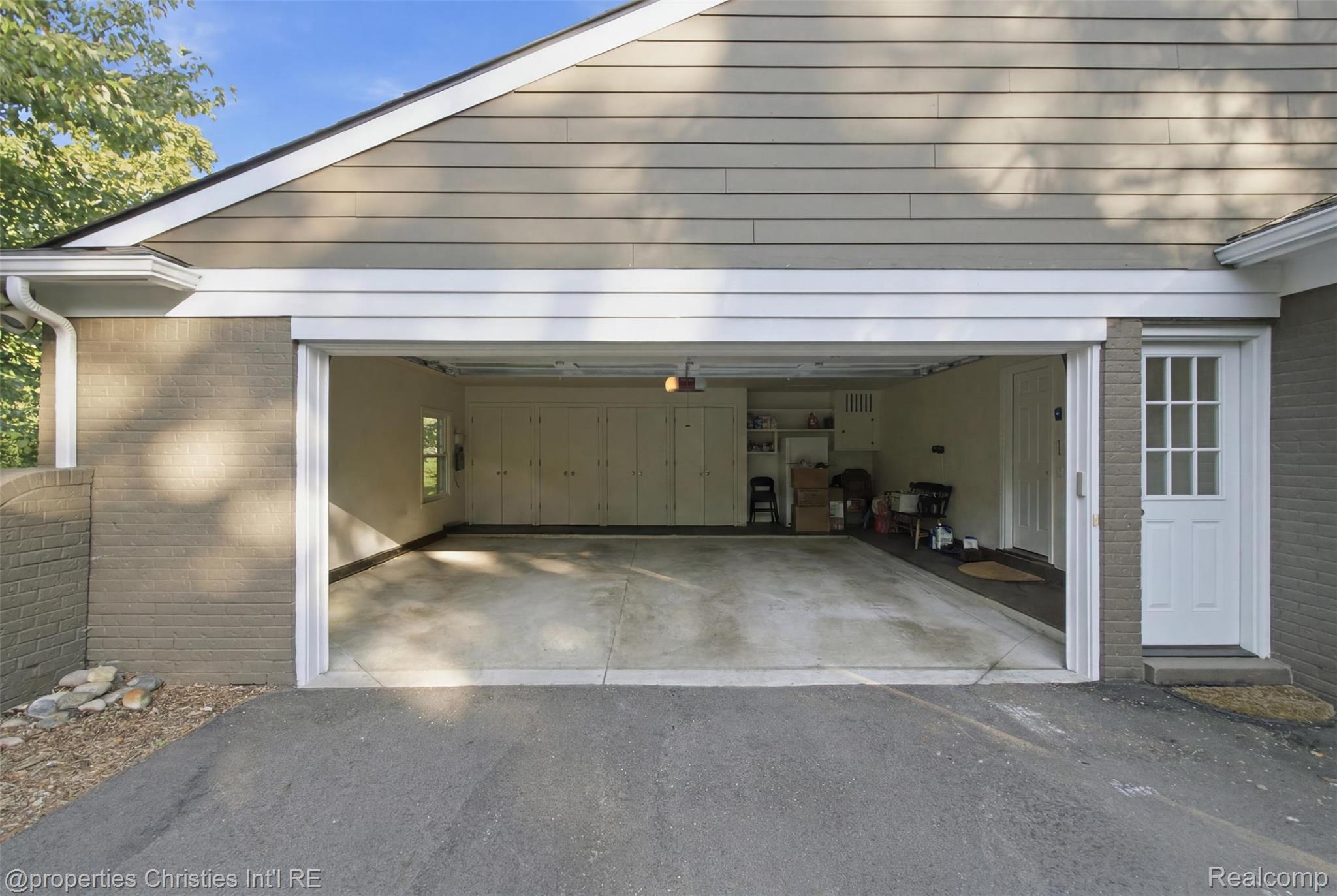 25235 Canterbury Road Franklin, MI 48025 - Photo 37 of 56 Two-car garage with concrete flooring and built-in cabinetry