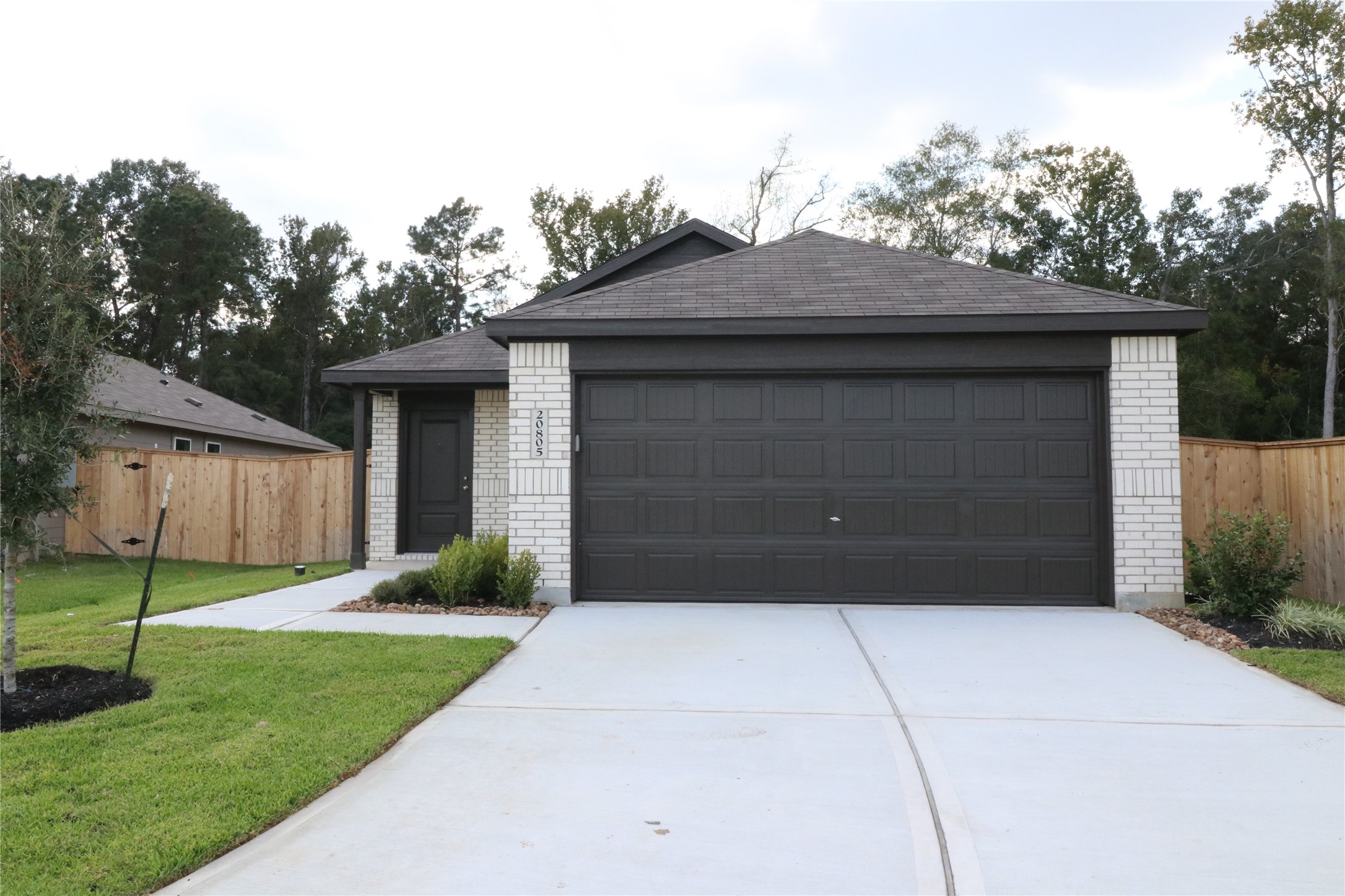20805 Le Scifo Court New Caney, TX 77357 - Photo 2 of 20 a front view of a house with a yard