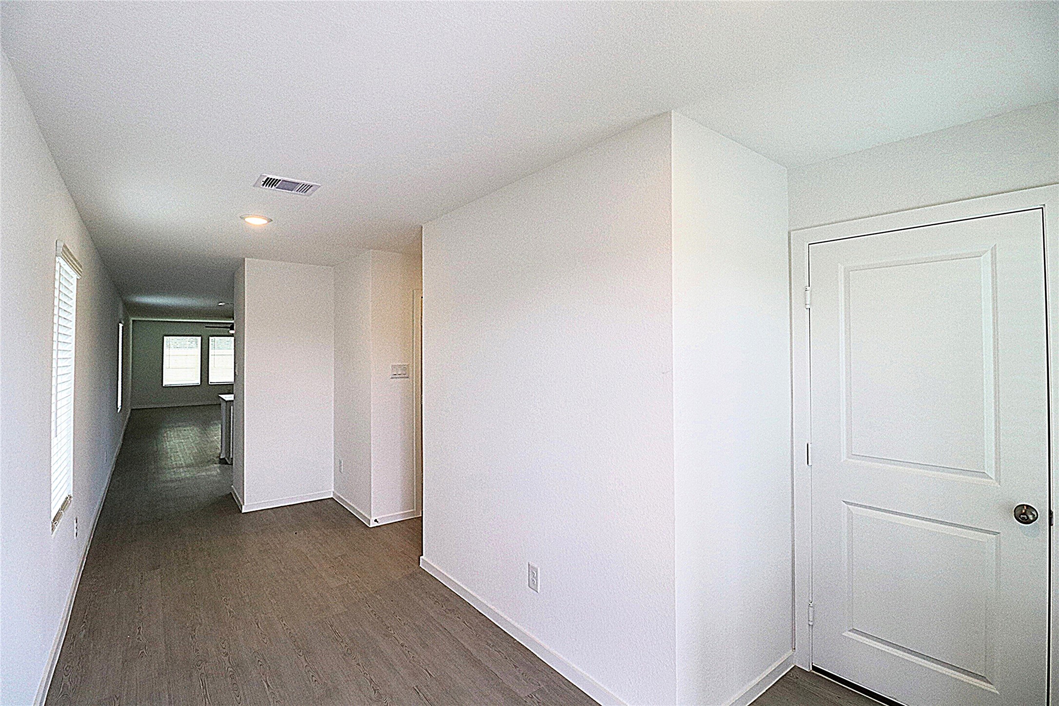 20805 Le Scifo Court New Caney, TX 77357 - Photo 3 of 20 a view of a hallway with wooden floor