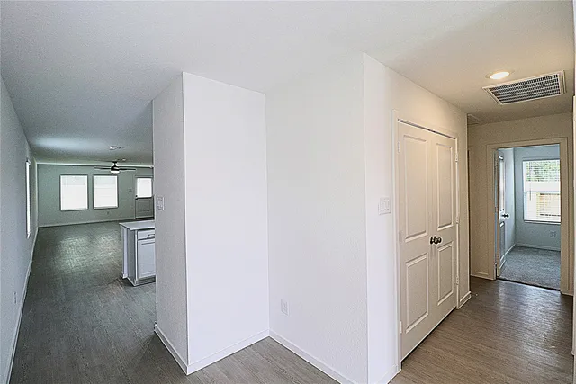 wooden floor in a hall with an entryway