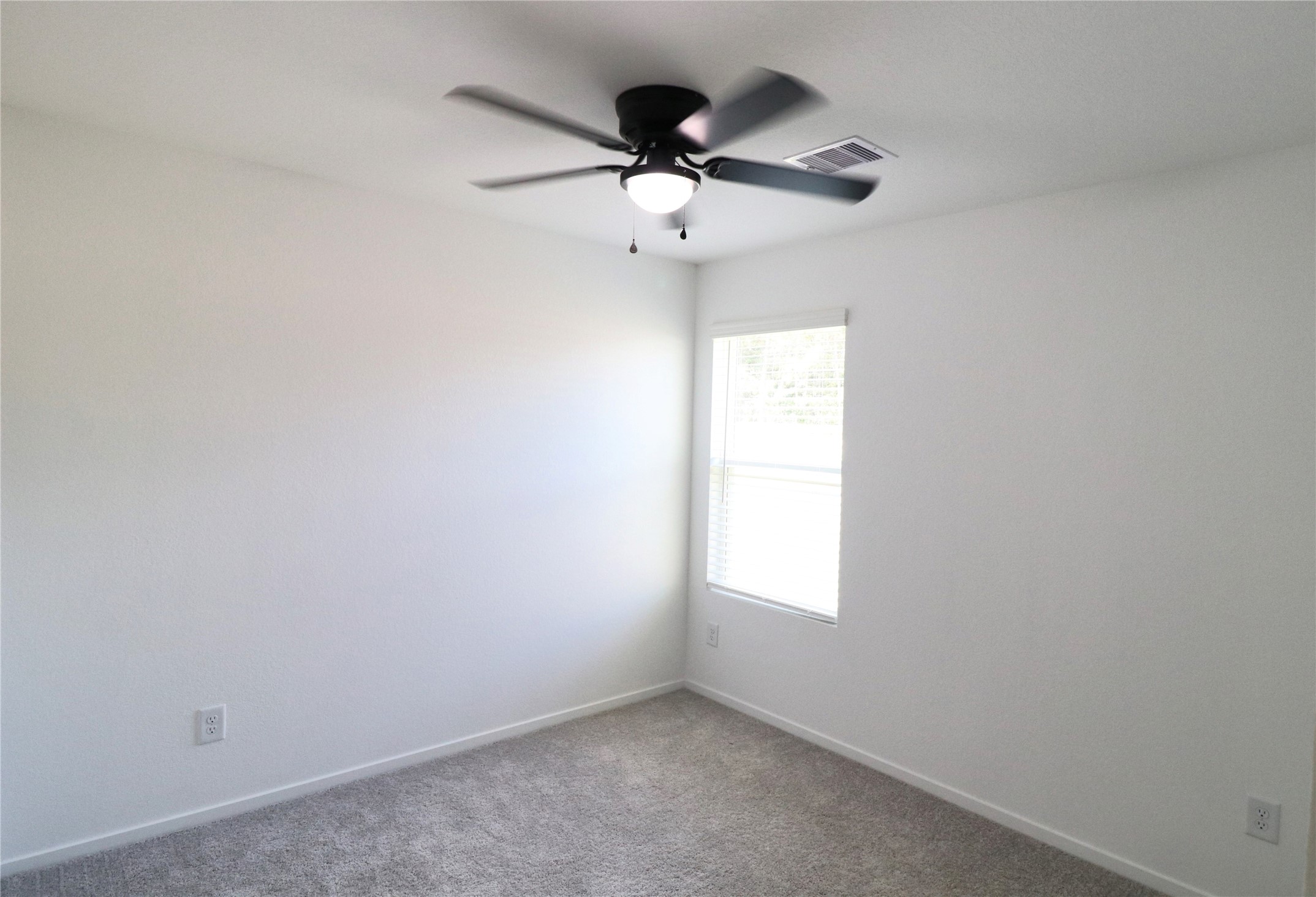 20805 Le Scifo Court New Caney, TX 77357 - Photo 7 of 20 an empty room with window and ceiling fan