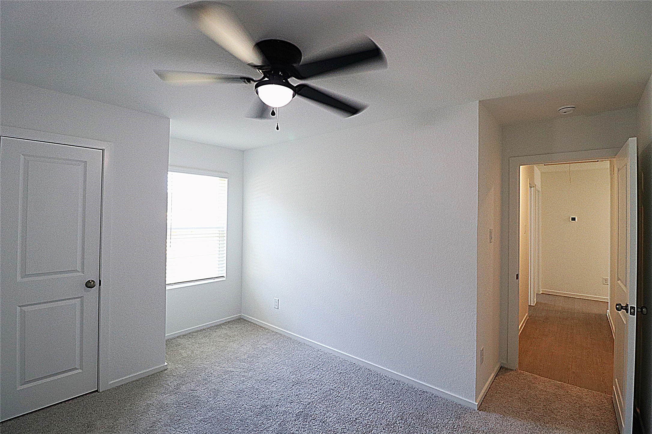20805 Le Scifo Court New Caney, TX 77357 - Photo 8 of 20 wooden floor in an empty room with a window
