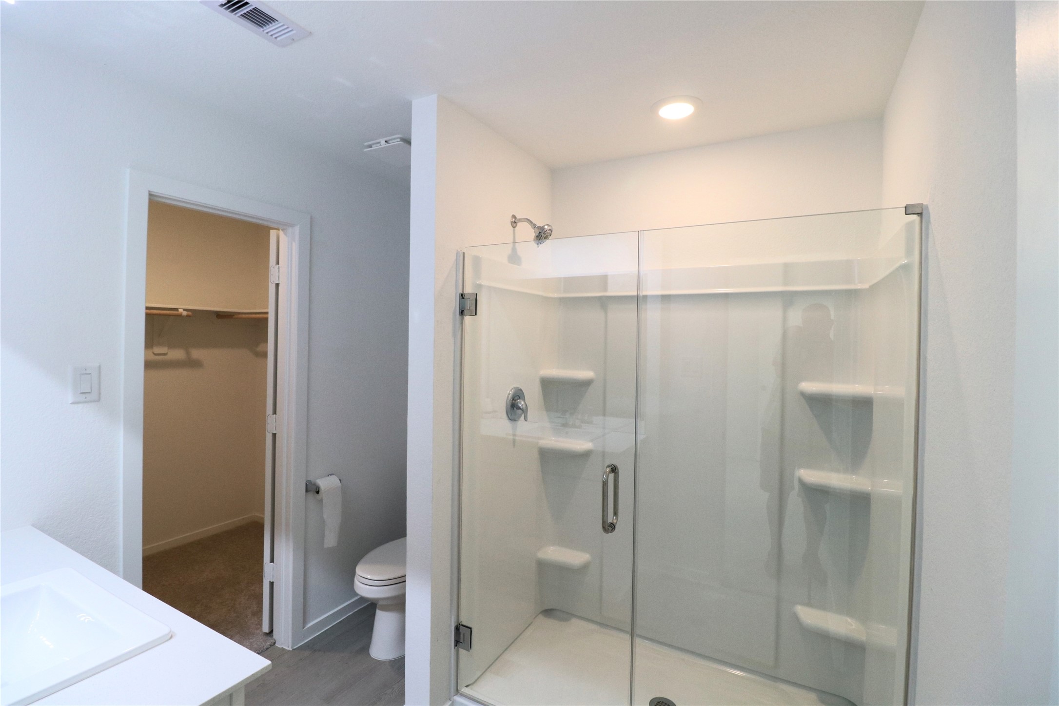 20805 Le Scifo Court New Caney, TX 77357 - Photo 10 of 20 a bathroom with a shower and a toilet