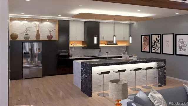 a kitchen with stainless steel appliances granite countertop a stove a sink and a refrigerator