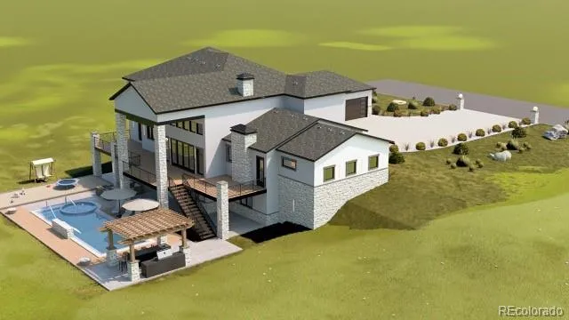 a aerial view of a house with swimming pool next to a yard