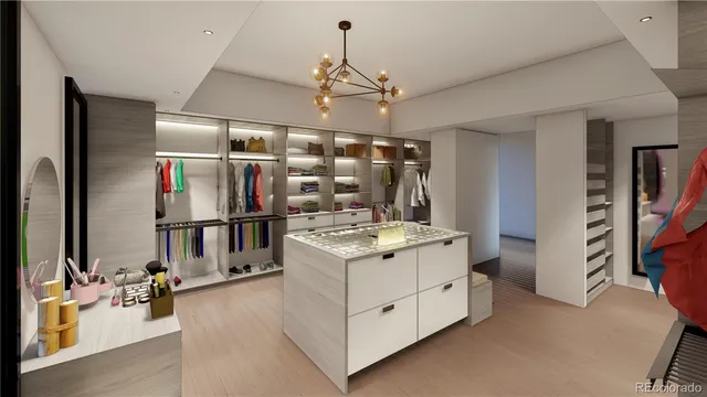 a kitchen that has a stove and a wooden floor