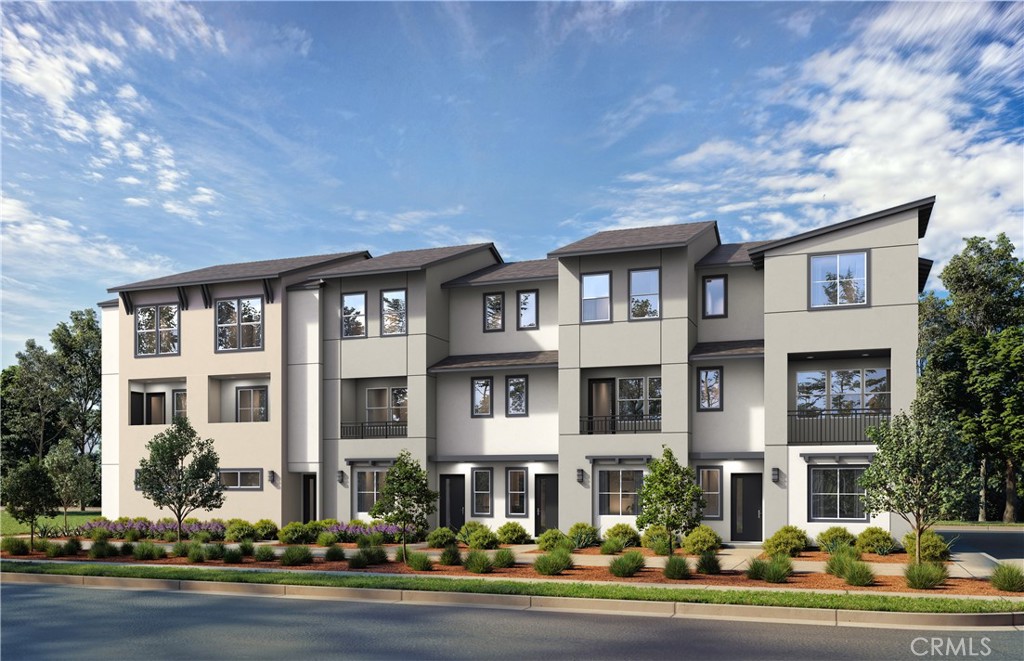 12720 Azure Way, Unit 29 Hawthorne, CA 90250 - Photo 2 of 5 front view of a brick house with a yard