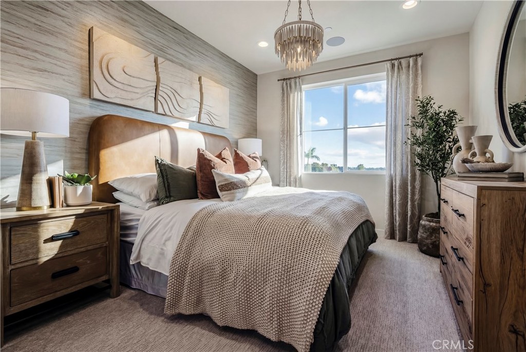 12720 Azure Way, Unit 29 Hawthorne, CA 90250 - Photo 6 of 10 a bedroom with a bed and a chandelier