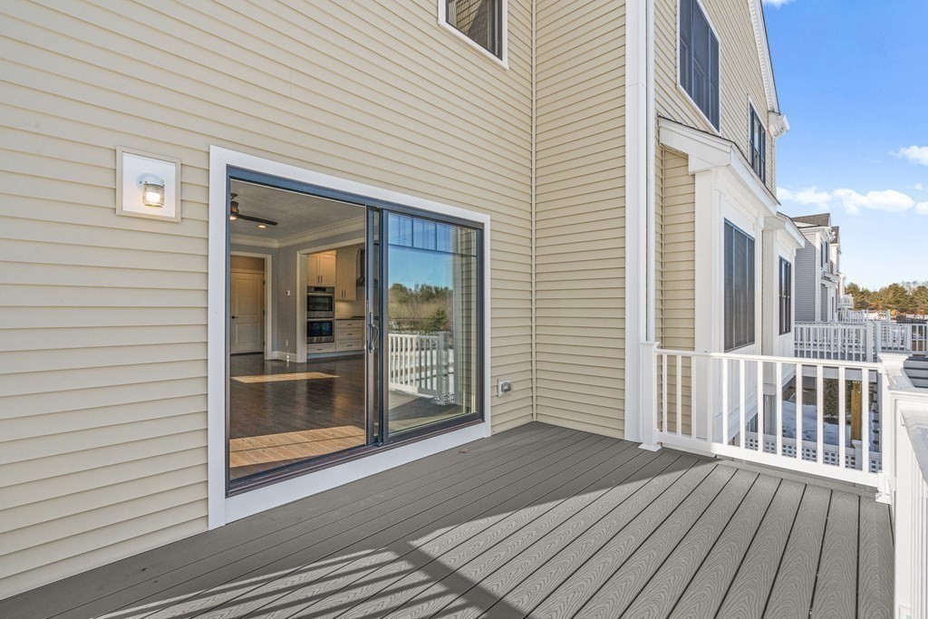 30 Cutter, Unit 30 Amesbury, MA 01913 - Photo 12 of 15 a view of a house with a deck