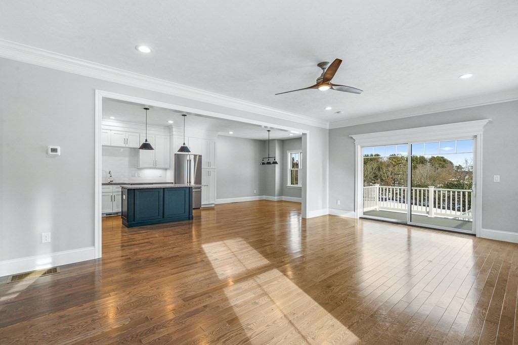 30 Cutter, Unit 30 Amesbury, MA 01913 - Photo 4 of 15 a view of an empty room with wooden floor and a window