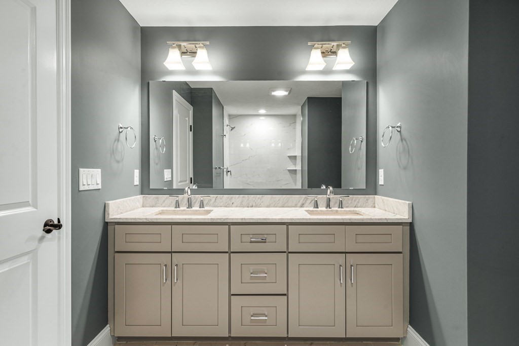 30 Cutter, Unit 30 Amesbury, MA 01913 - Photo 8 of 15 a bathroom with double sink and a mirror