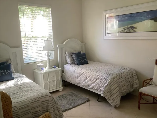 a room with a cabinet and a painting on the wall