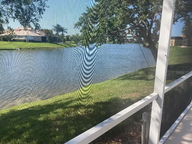 a view of a house with backyard and porch