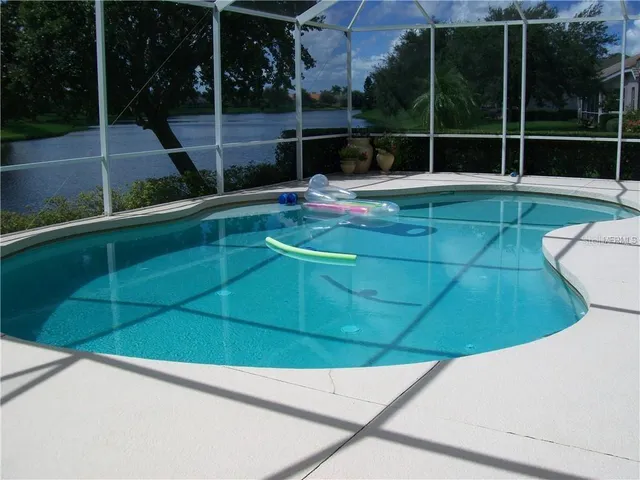 a view of a chair and table in the outdoor space