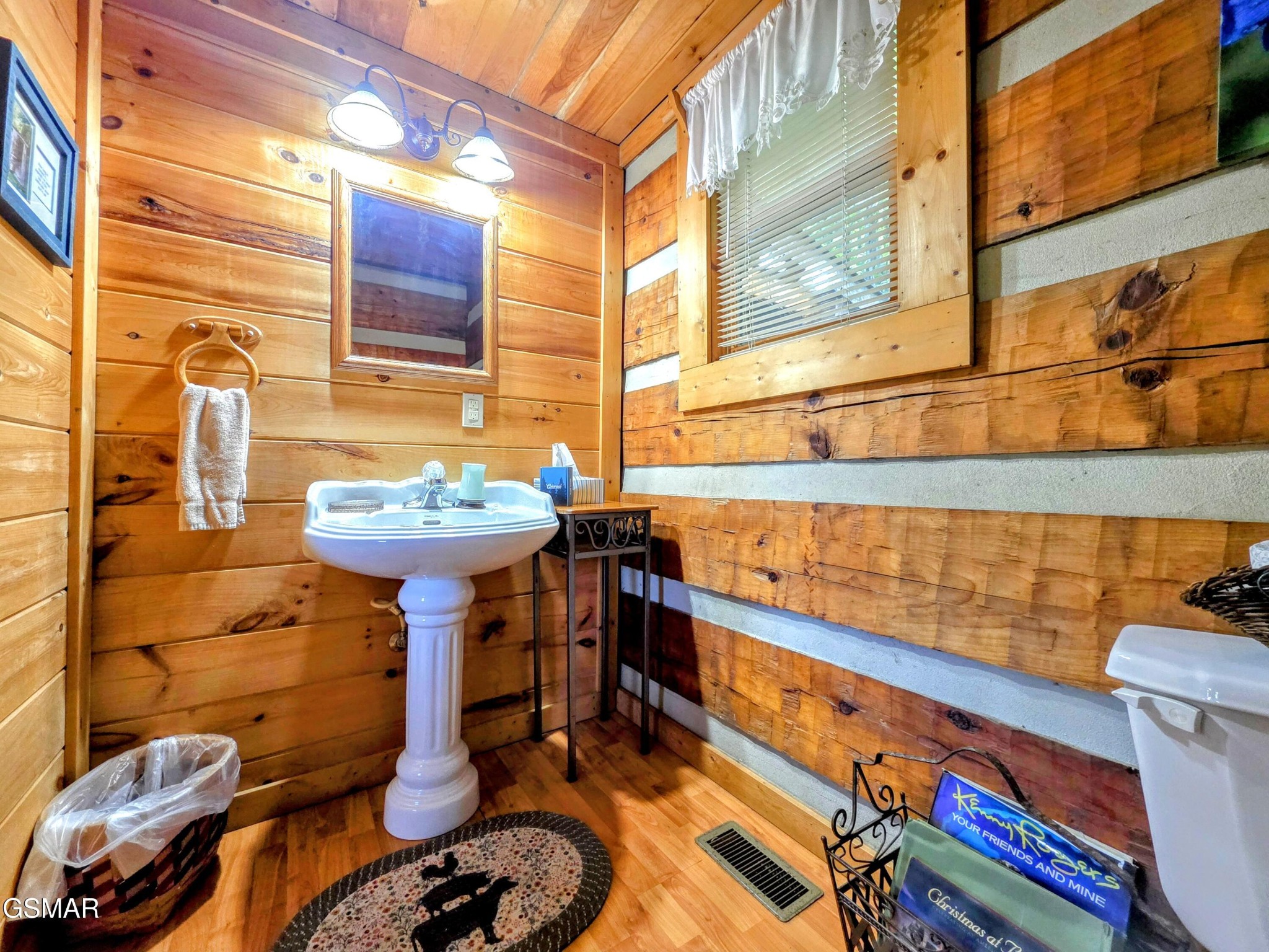 2570 Pittman Center Road Sevierville, TN 37876 - Photo 48 of 61 a bathroom with a sink and a mirror