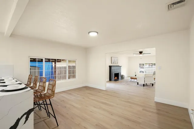 a view of a livingroom with furniture and a window