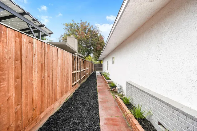 a view of balcony with wooden floor and stairs