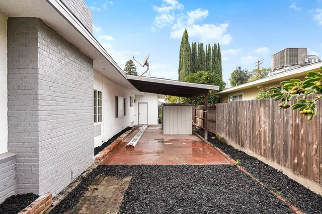 a view of a back yard with a patio