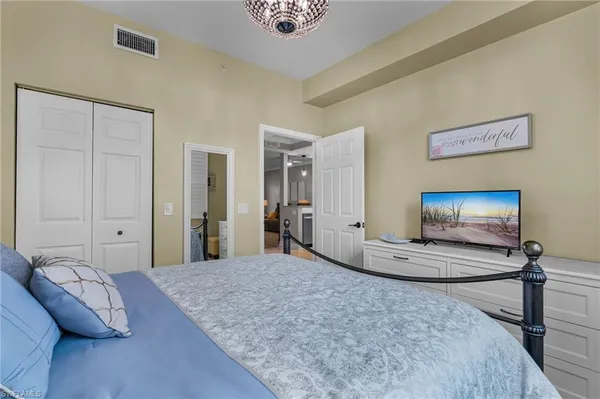 a view of a livingroom with furniture and a flat screen tv
