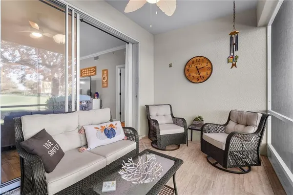 a living room with furniture and a window
