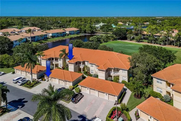 an aerial view of residential houses and outdoor space