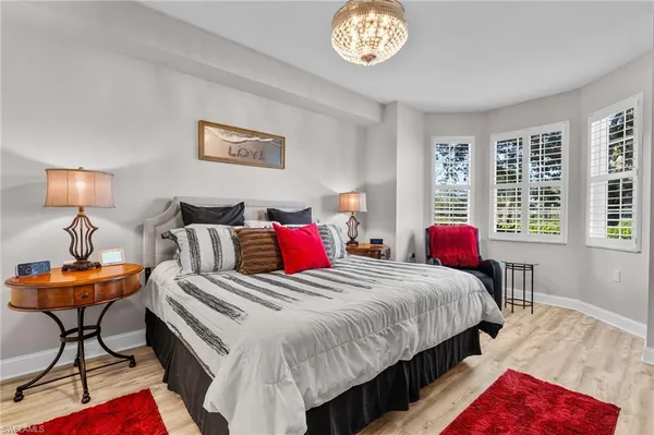 a bedroom with bed and a window