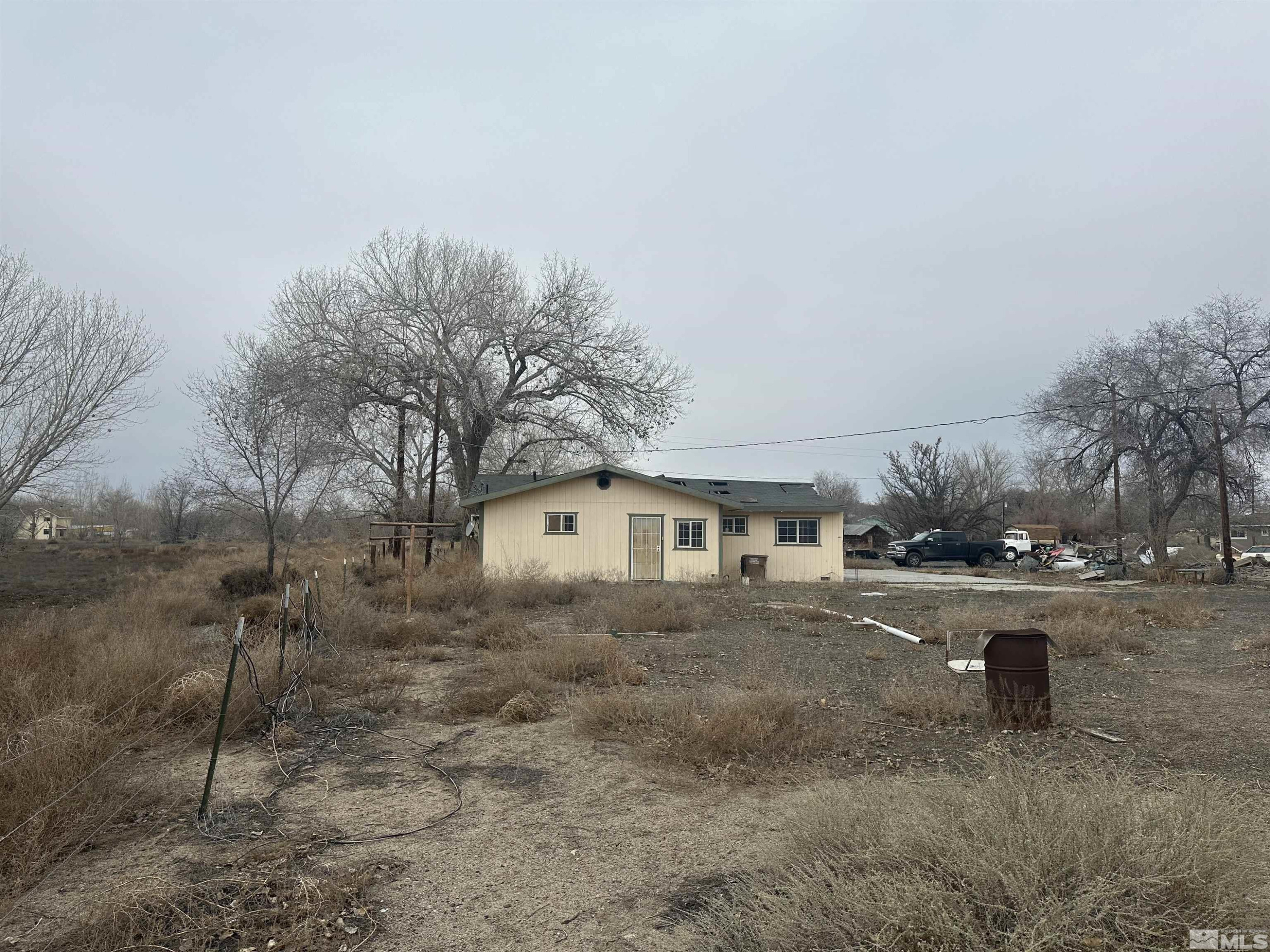 3275 Alcorn Road Fallon, NV 89406 - Photo 26 of 33 a front view of a house with a yard