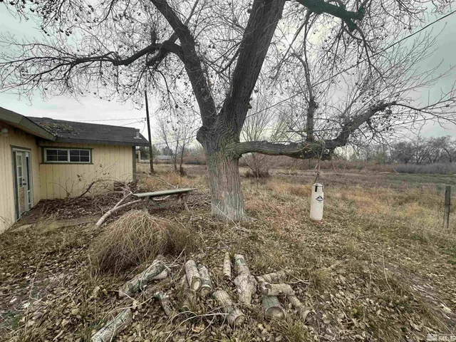 a view of a house with snow on the road