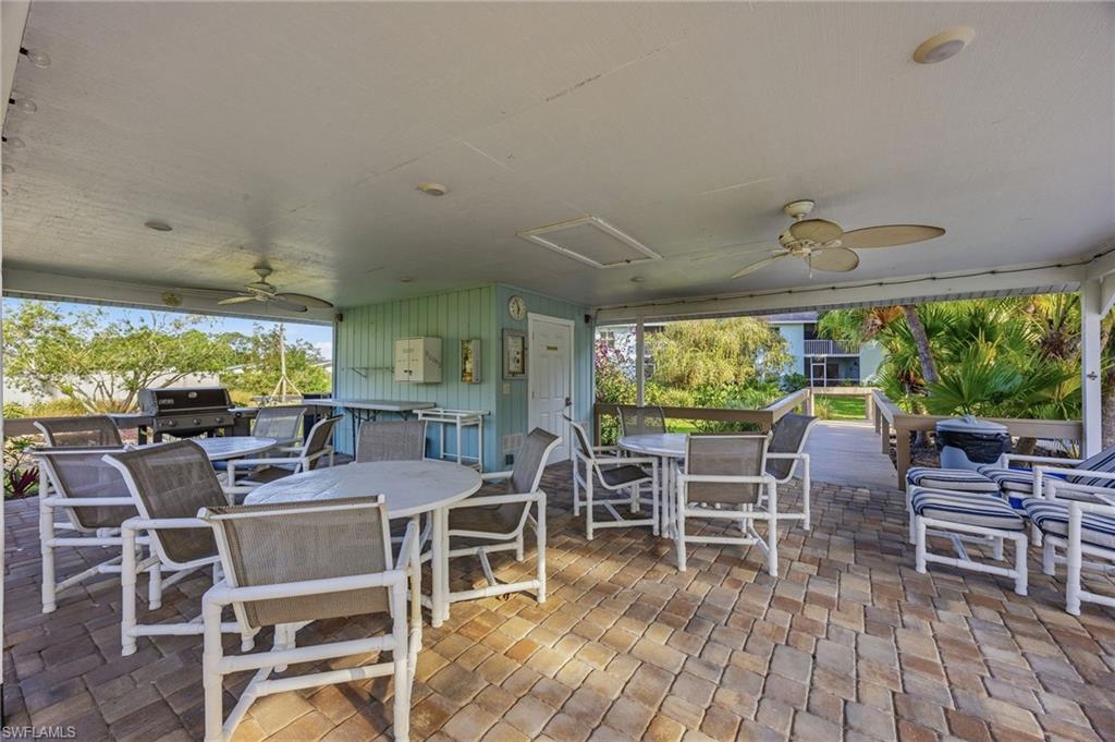 5737 Whitaker Road, Unit C101 Naples, FL 34112 - Photo 22 of 28 a view of a dining room with furniture window and outside view