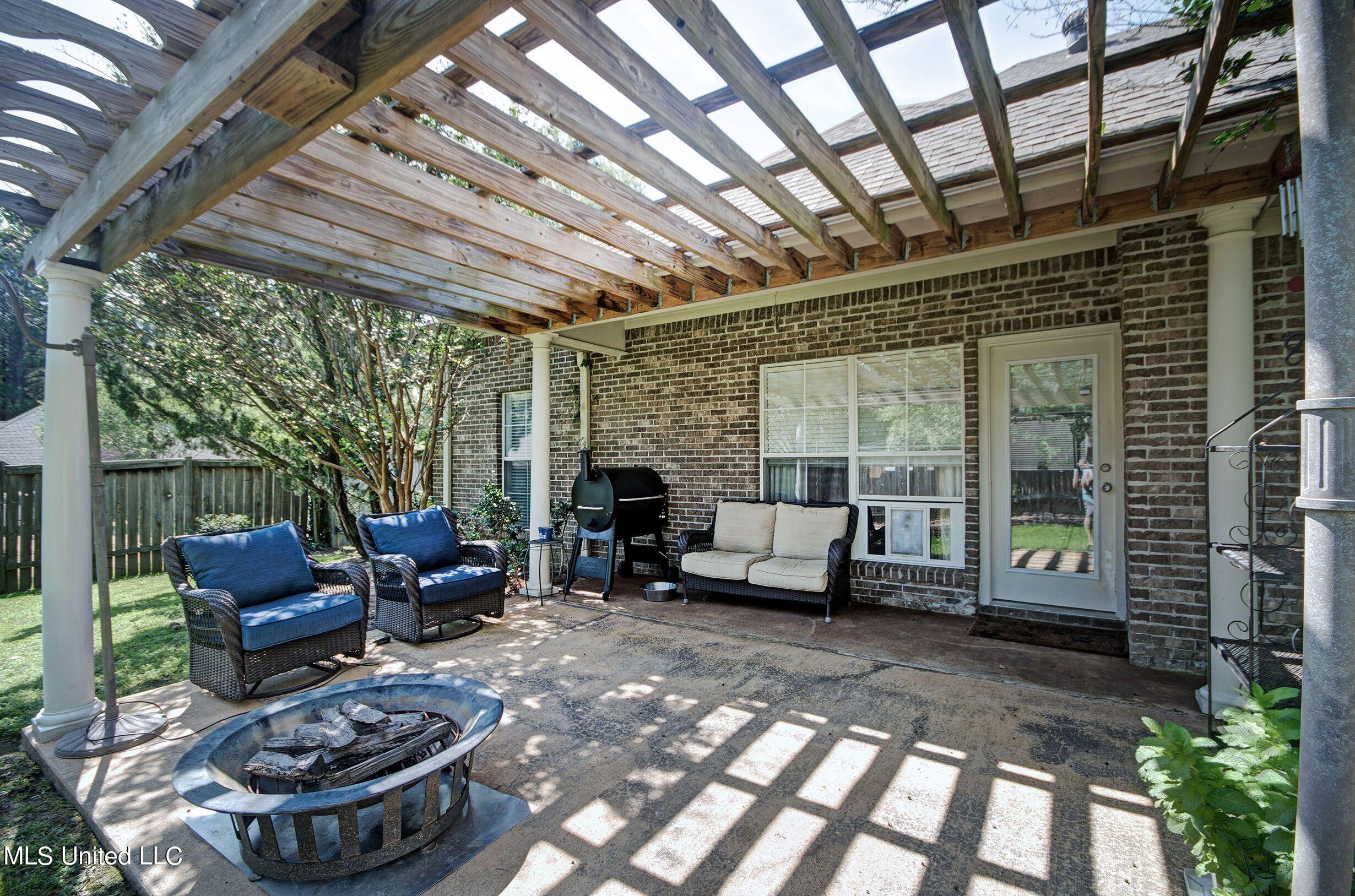 121 Prescott Ridge Madison, MS 39110 - Photo 6 of 33 back patio and pergola