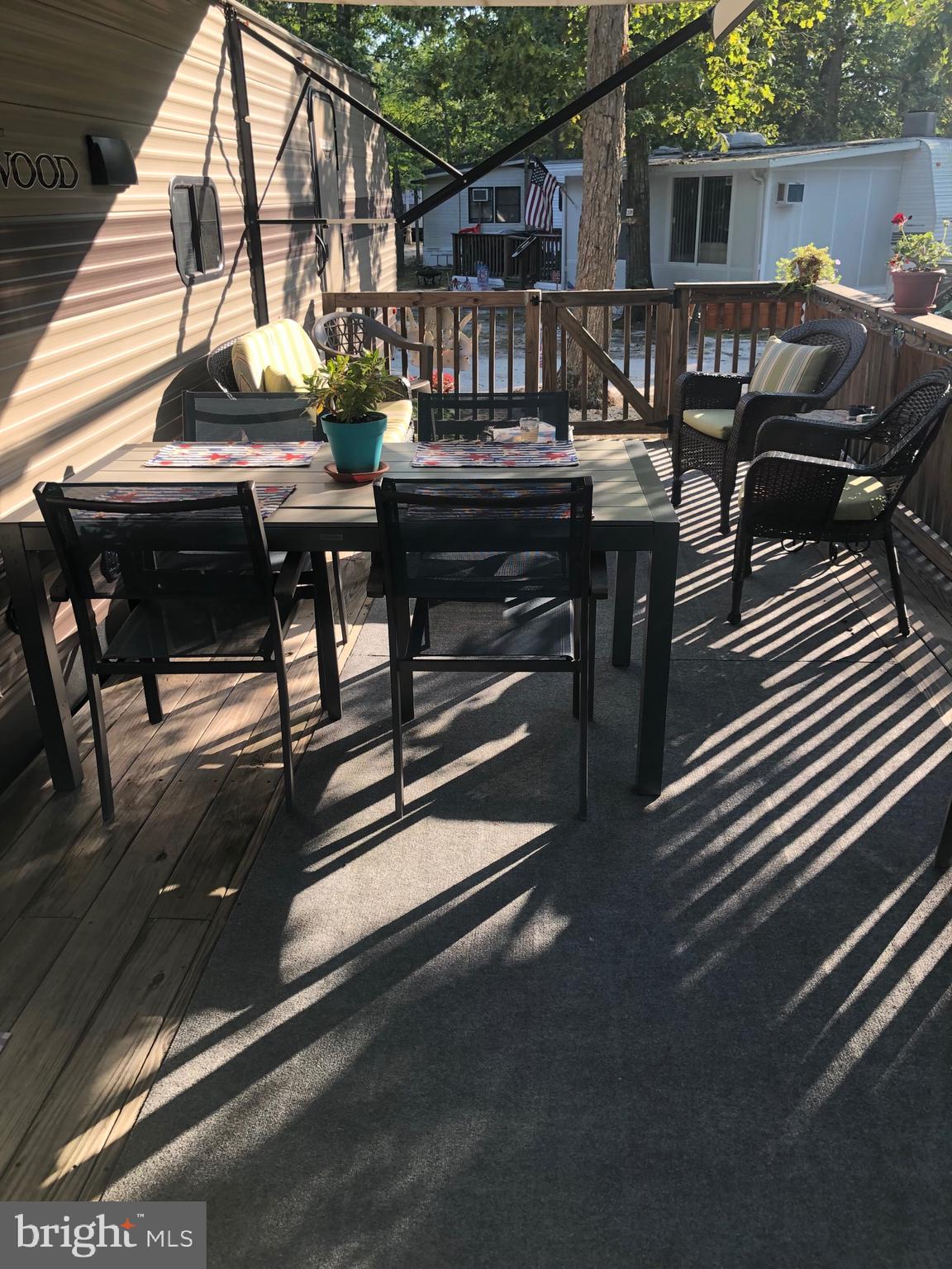 60 Corsons Tavern Road, Unit 342 Ocean View, NJ 08230 - Photo 3 of 19 a view of backyard with outdoor seating and wooden floor