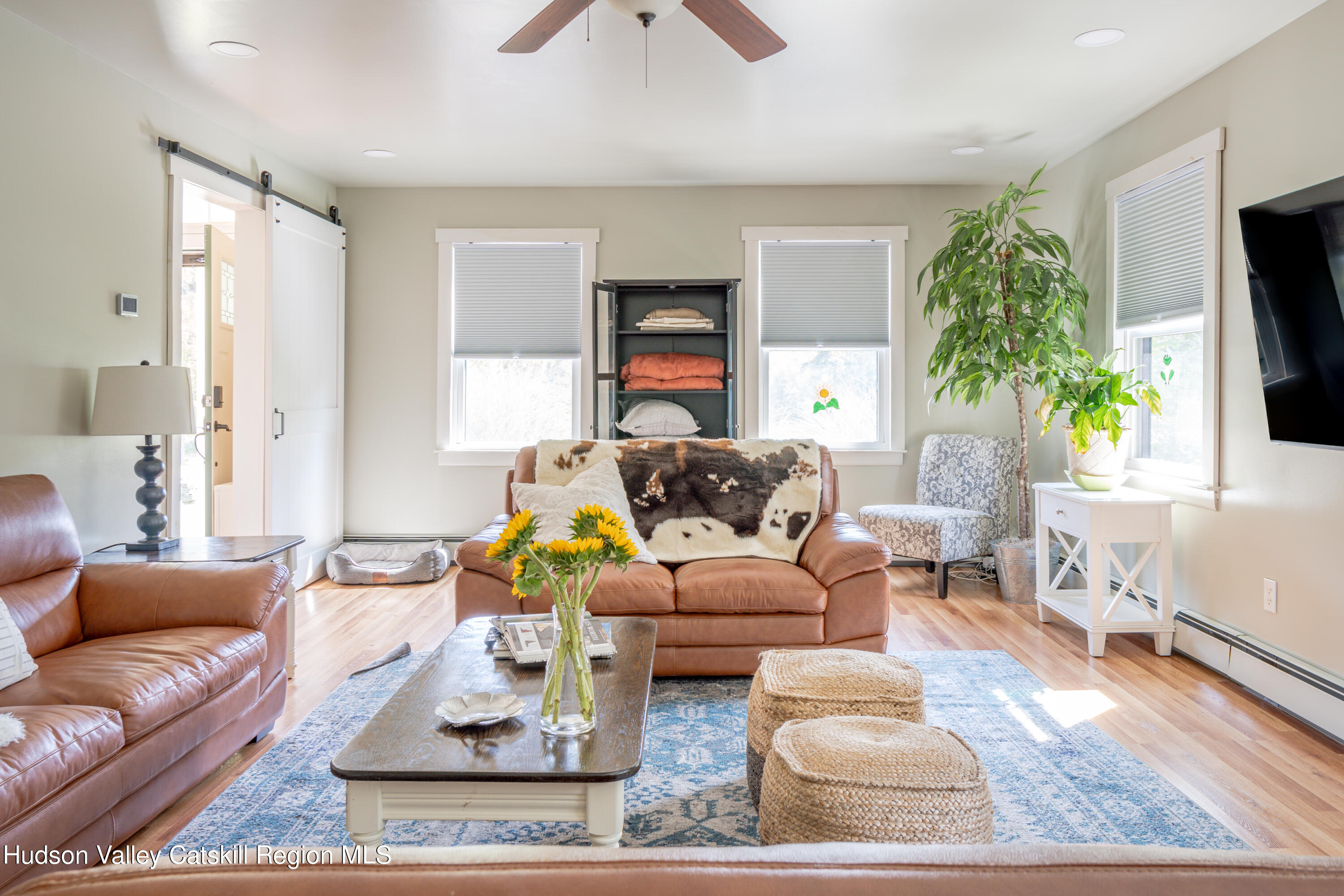 255 High Falls Road Saugerties, NY 12477 - Photo 11 of 33 a living room with furniture and a flat screen tv