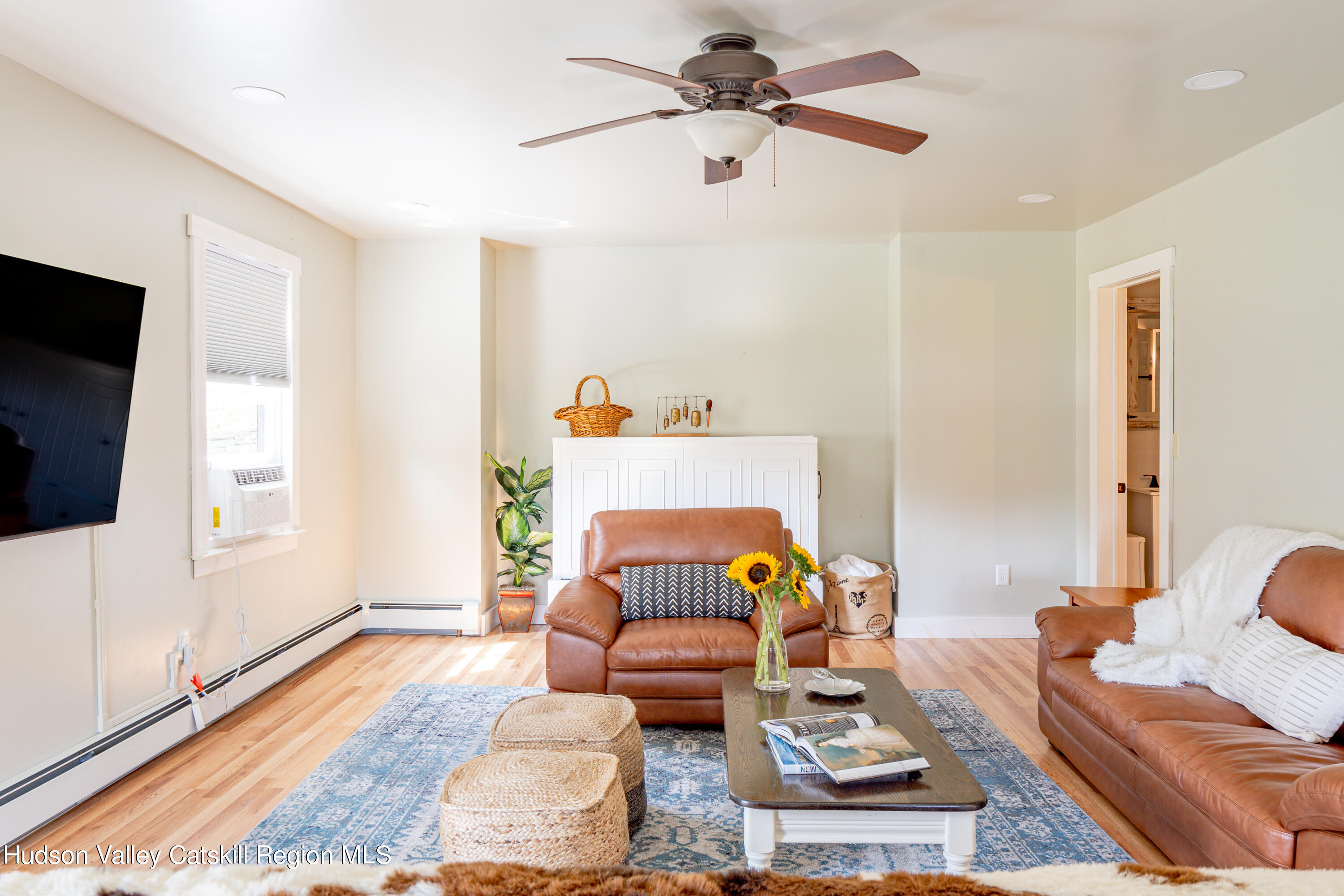 255 High Falls Road Saugerties, NY 12477 - Photo 12 of 33 a living room with furniture and a flat screen tv