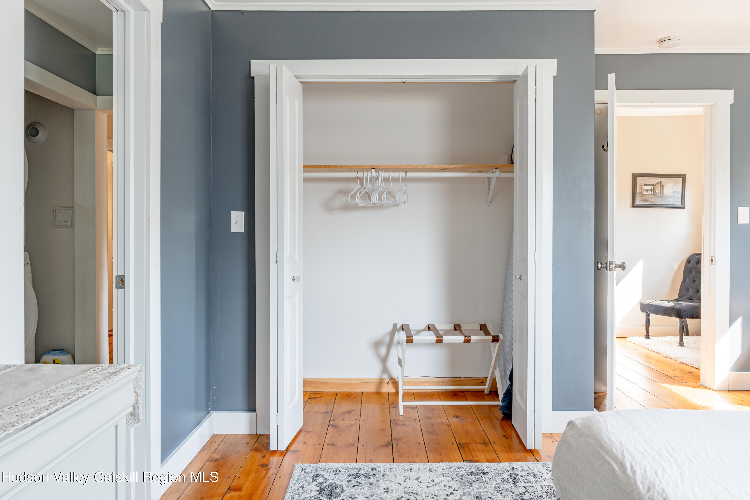 255 High Falls Road Saugerties, NY 12477 - Photo 14 of 33 a bedroom with a bed and a table with closet