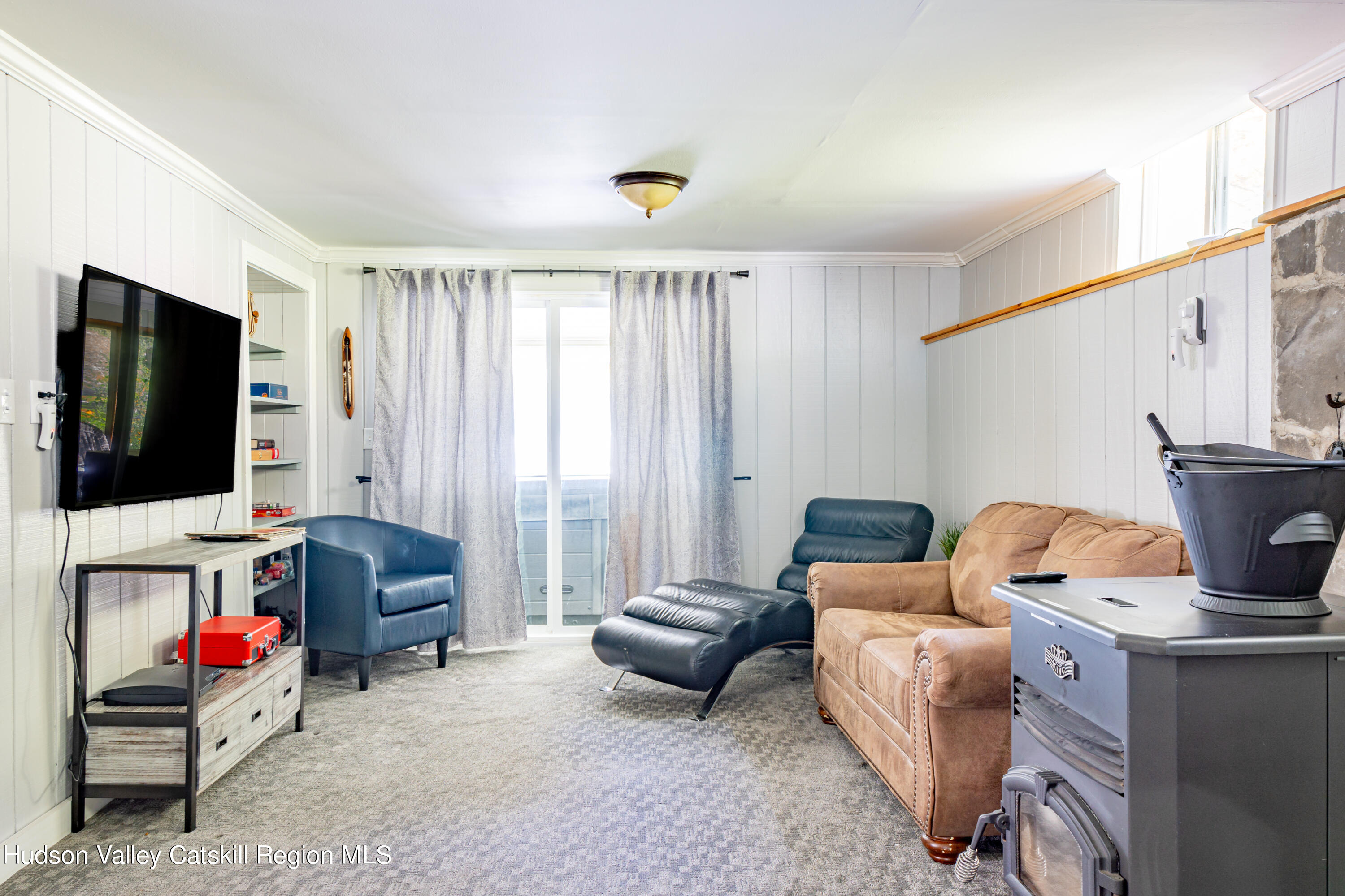 255 High Falls Road Saugerties, NY 12477 - Photo 21 of 33 a living room with furniture and a flat screen tv