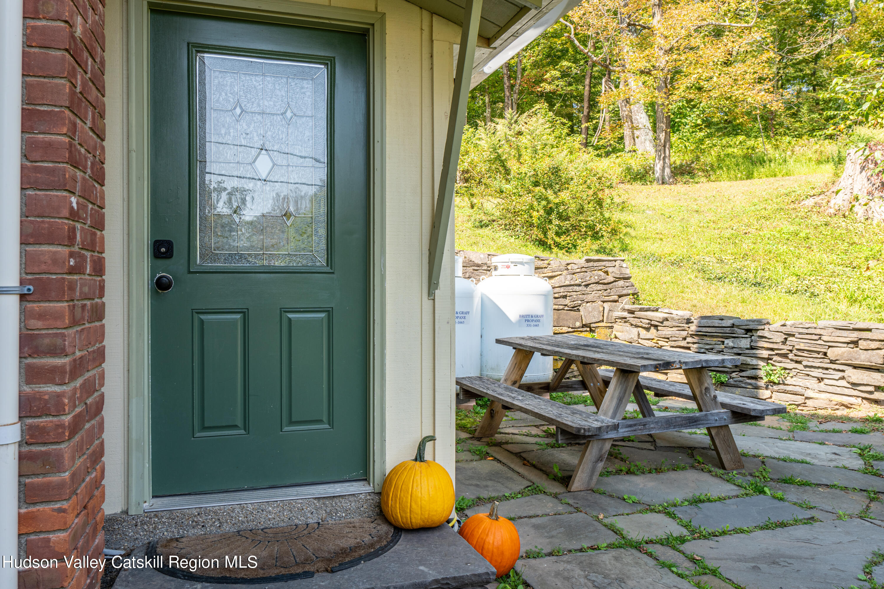 255 High Falls Road Saugerties, NY 12477 - Photo 25 of 33 a backyard of a house with table and chairs