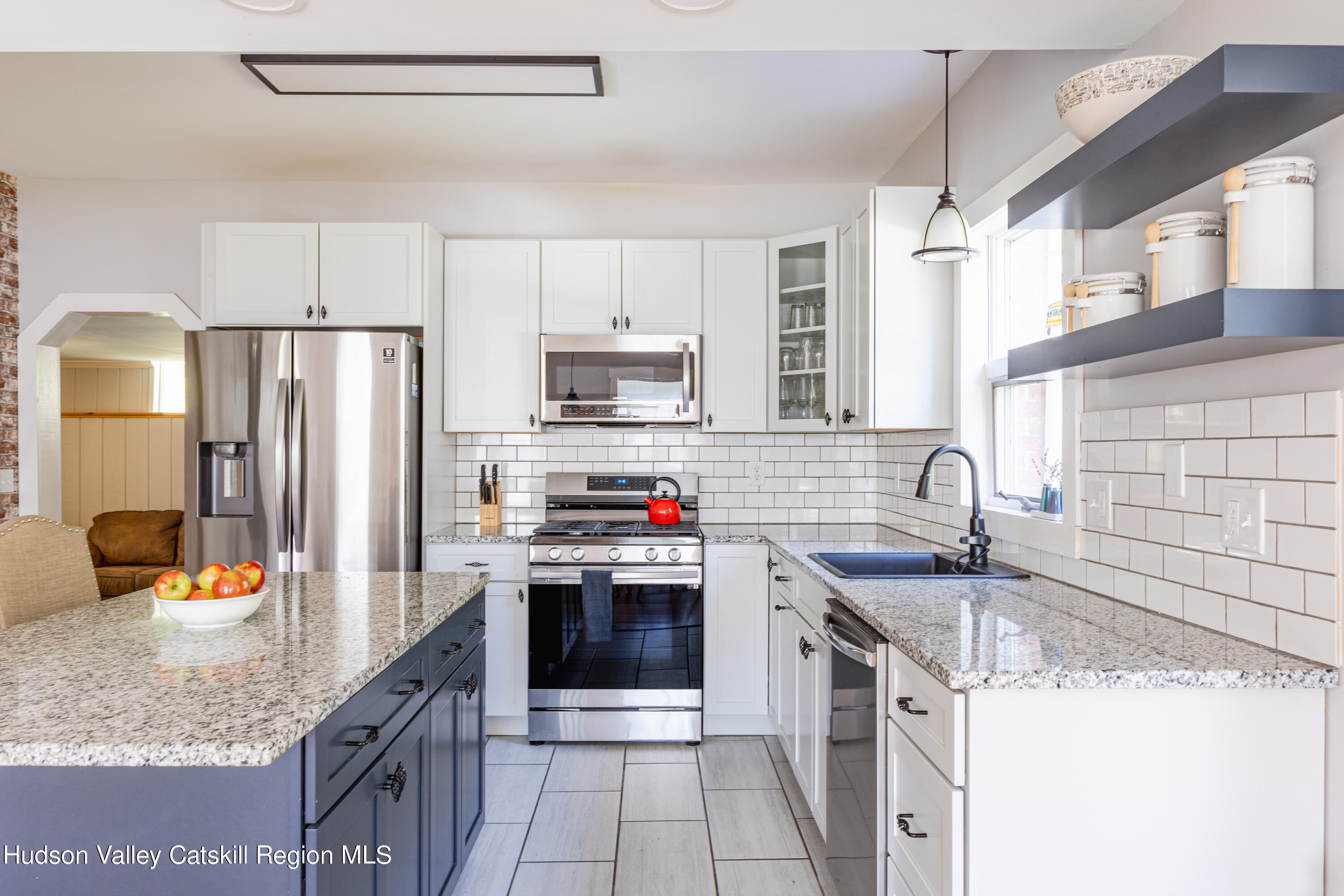 255 High Falls Road Saugerties, NY 12477 - Photo 7 of 33 a kitchen with stainless steel appliances granite countertop a sink stove and refrigerator