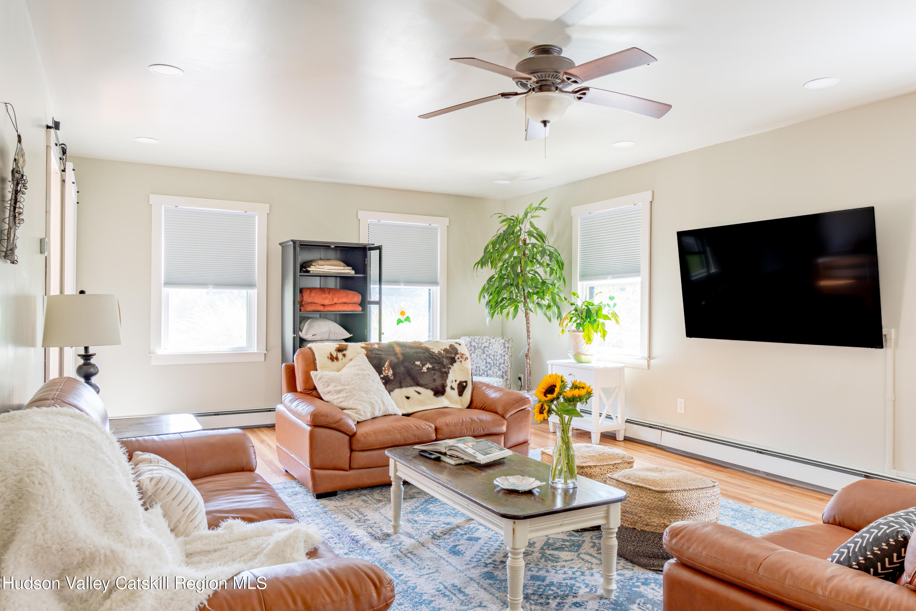 255 High Falls Road Saugerties, NY 12477 - Photo 10 of 33 a living room with furniture and a flat screen tv