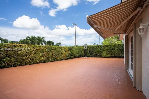 a view of a backyard of the house