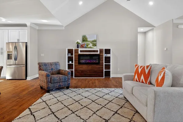 a bedroom with a bed and a night stand