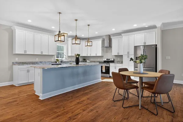 a view of a room with wooden floor