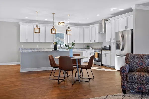 a white toilet sitting next to a bathroom sink