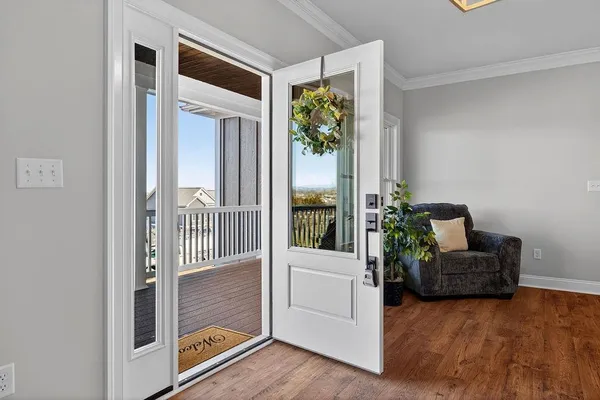 a kitchen with granite countertop white cabinets and stainless steel appliances