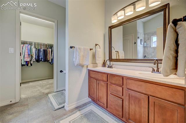9470 Rockingham Drive Peyton, CO 80831 - Photo 17 of 39 master bath has walk-in closet, double vanity