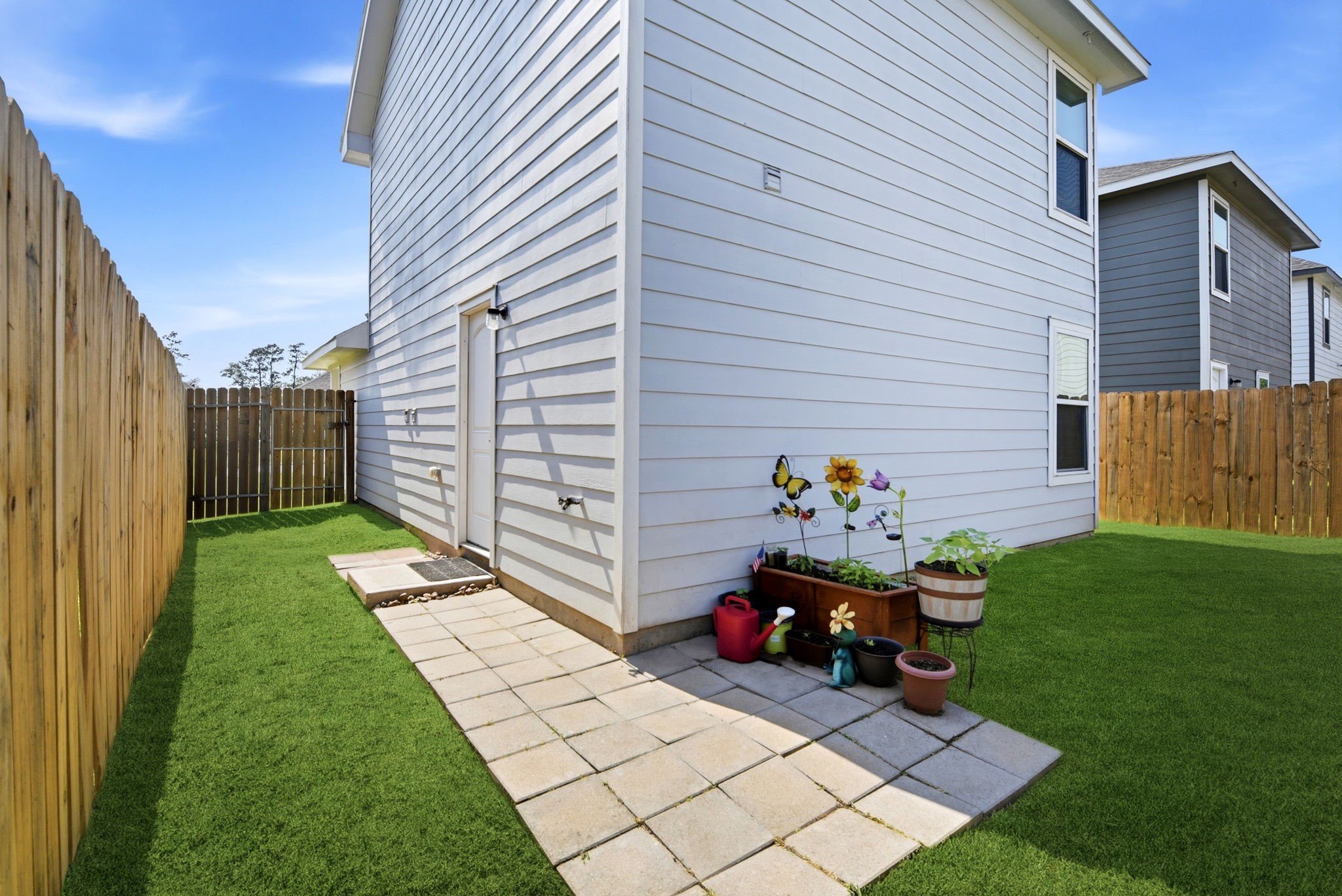9819 Emerald Stone Way Conroe, TX 77306 - Photo 38 of 38 a backyard of a house with seating space