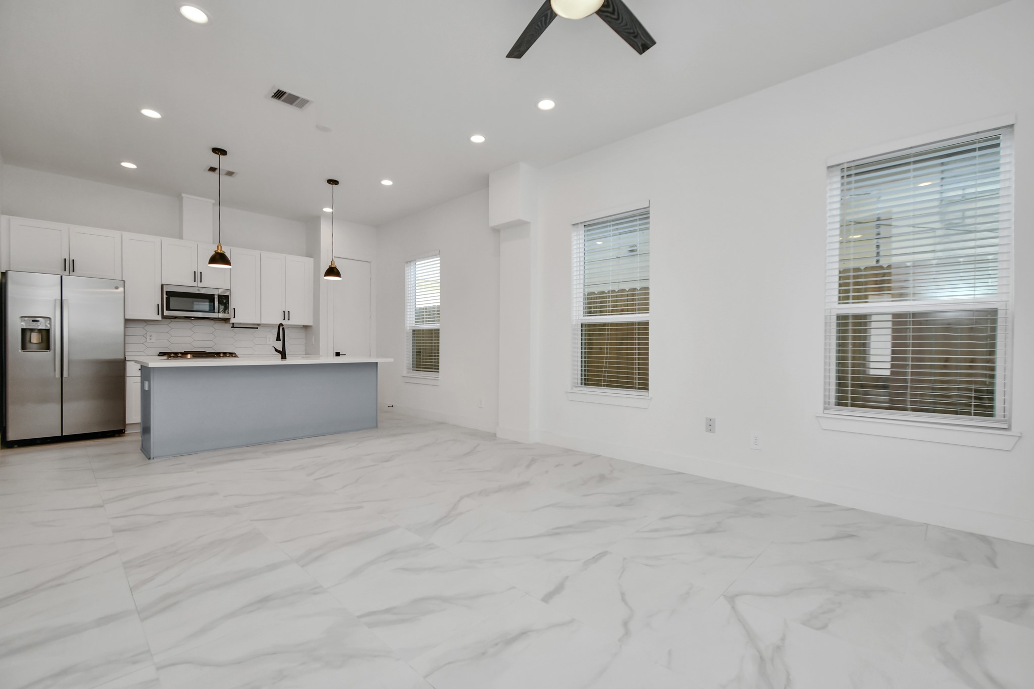 853 Mansfield Street, Unit E Houston, TX 77091 - Photo 11 of 47 a view of kitchen with refrigerator and window